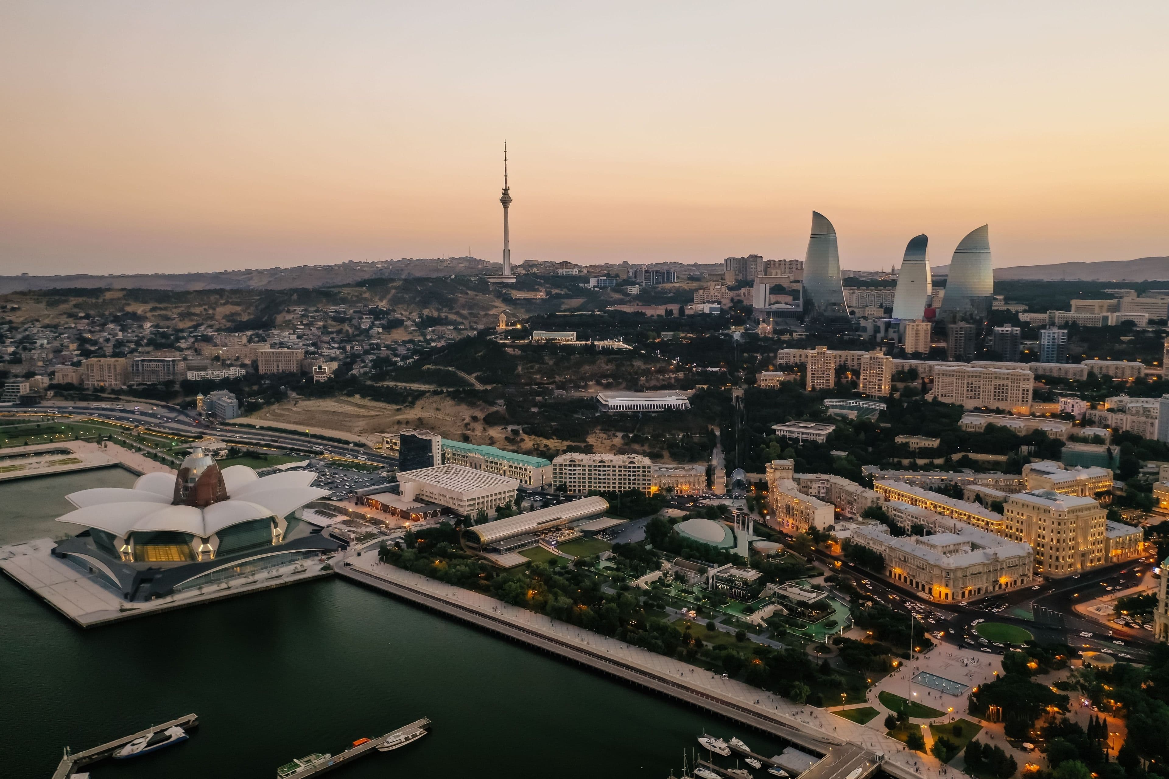 Baku's Caspian waterfront and the Flame Towers at sunset