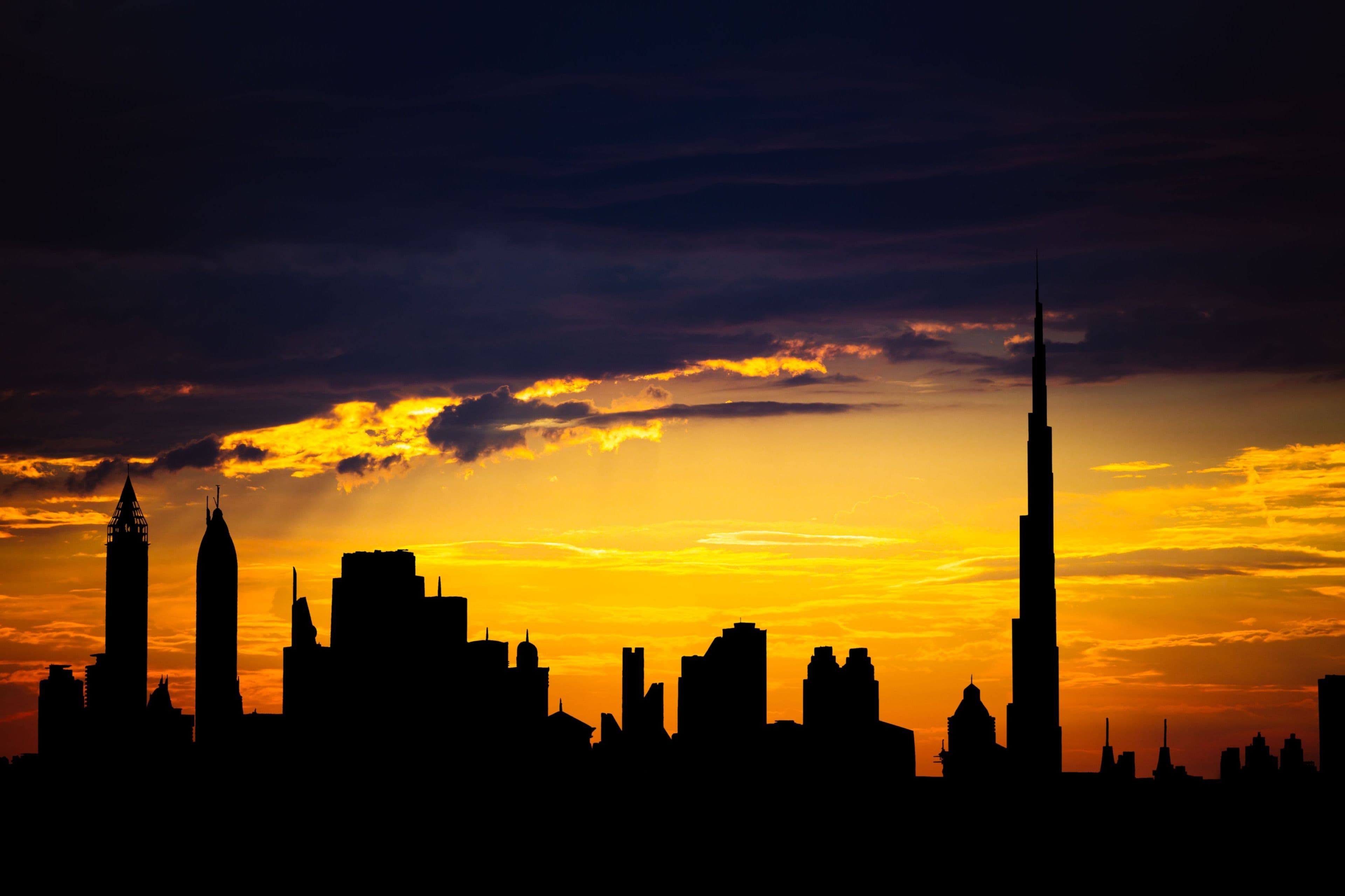 Dubai skyline at sunset with the Burj Khalifa