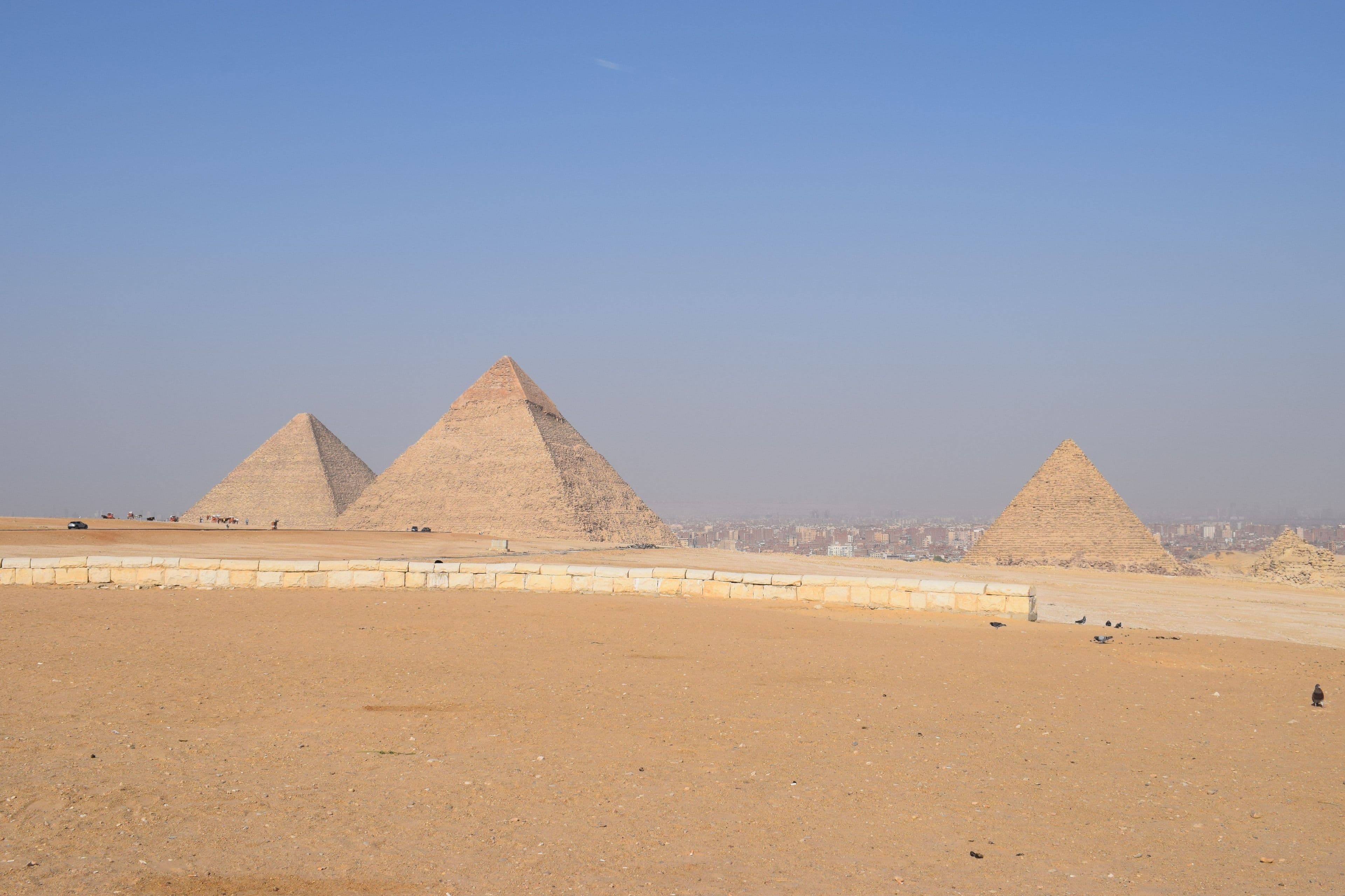 The Great Pyramids of Giza under a blue sky