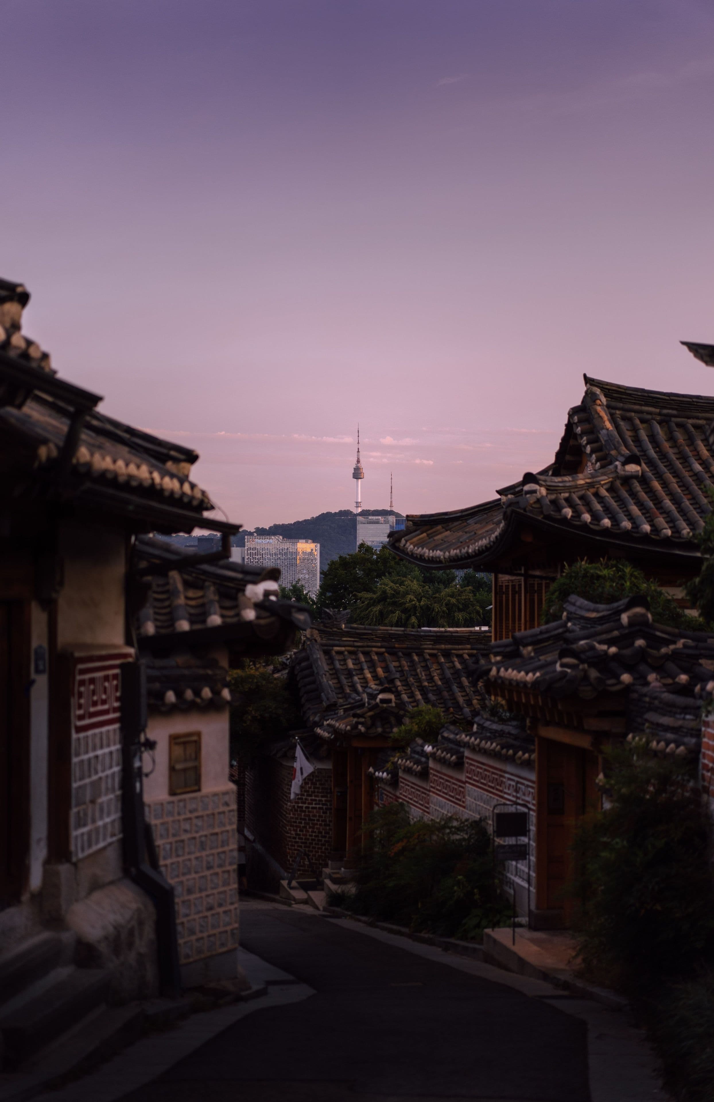 Traditional hanok rooftops and N Seoul Tower at sunset, Seoul