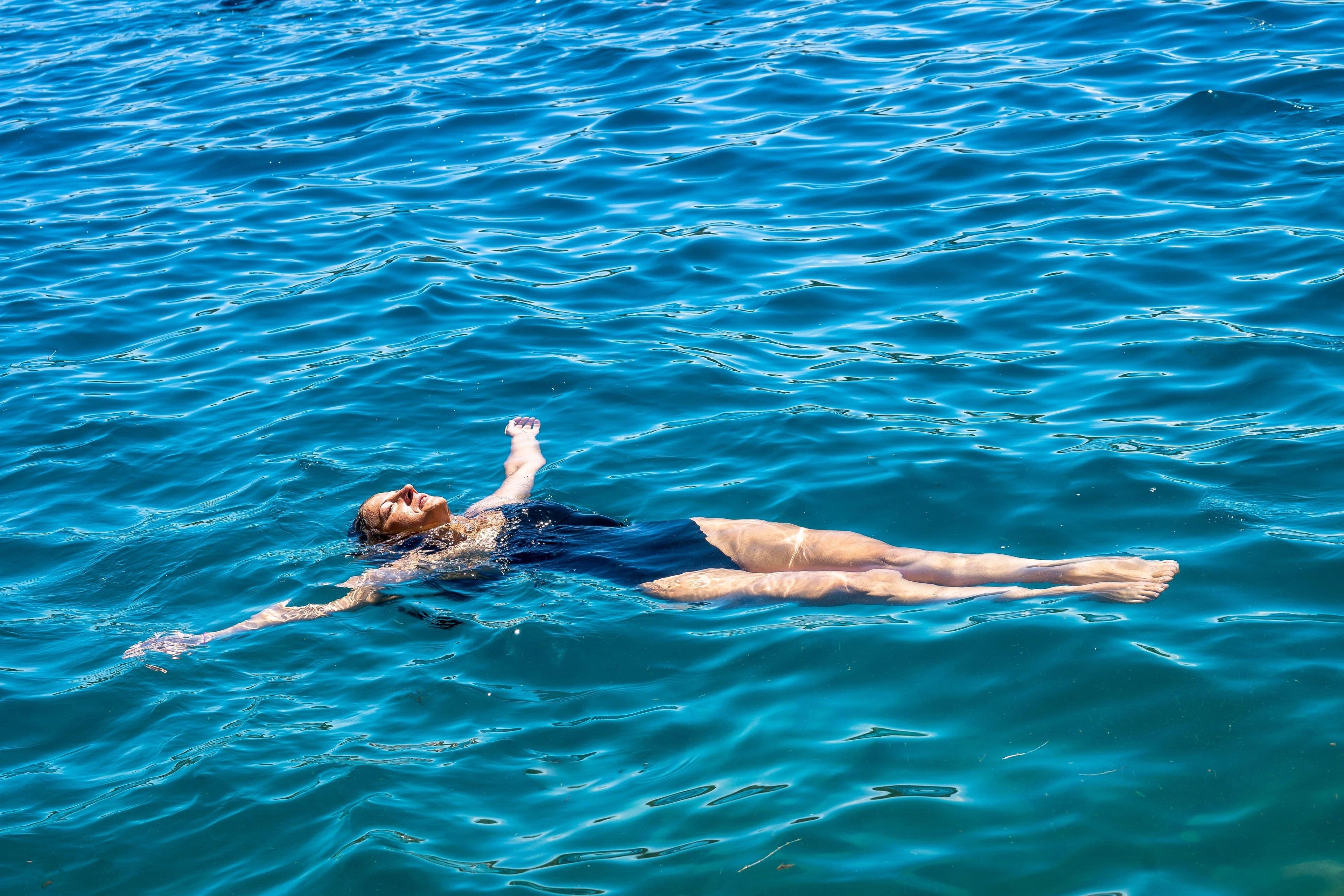 A person floating effortlessly on the Dead Sea