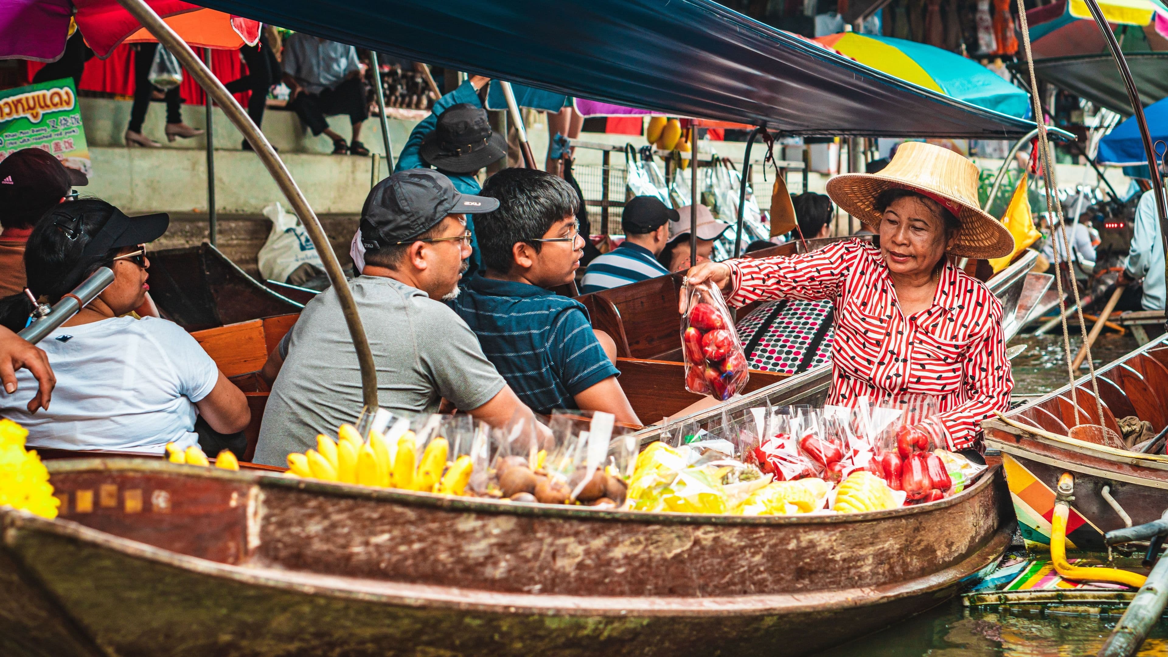 A Thai floating market with fruit boats