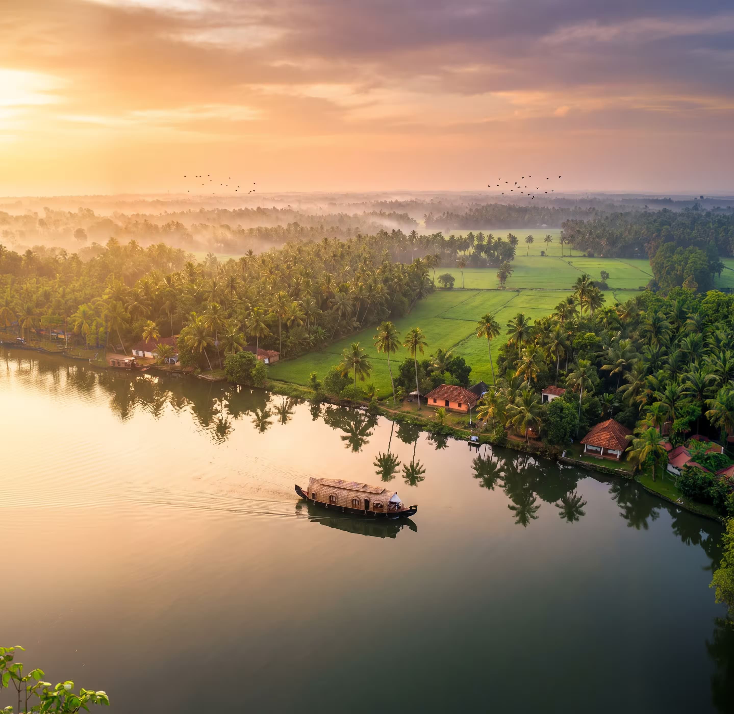 House boat cruising Kerala backwaters at sunrise