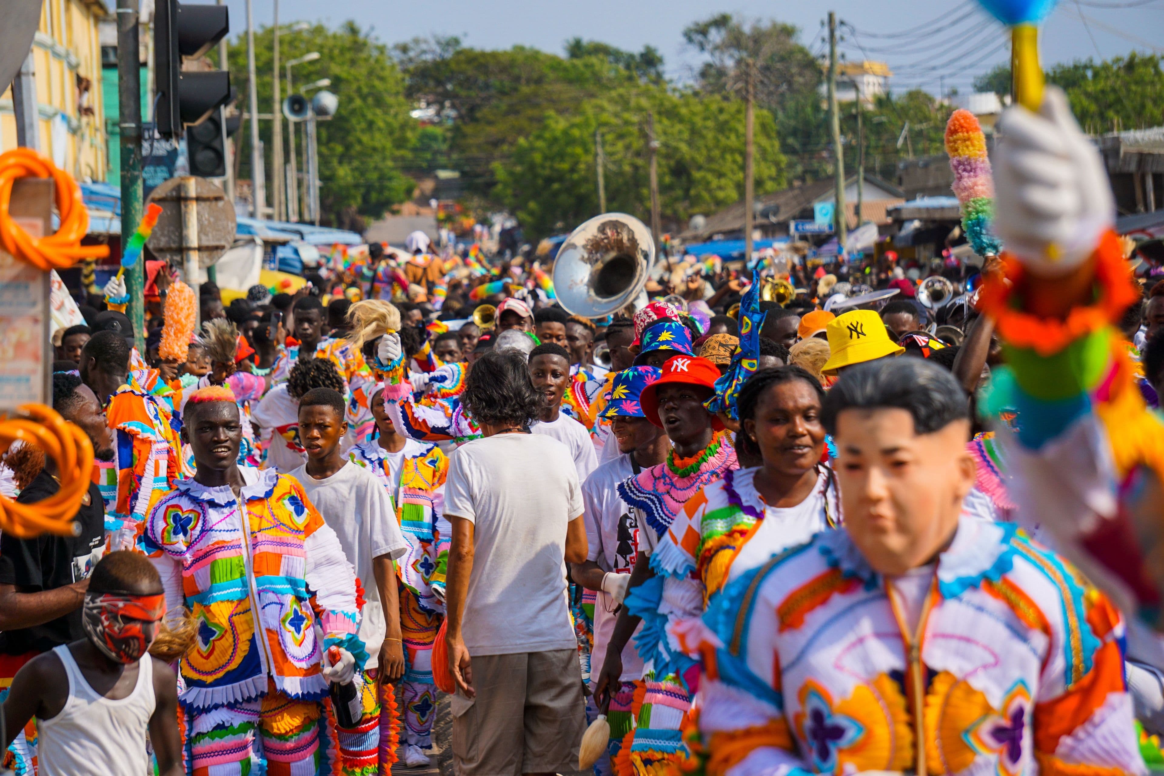 A Junkanoo street parade filling the road with brass and colour, Bahamas