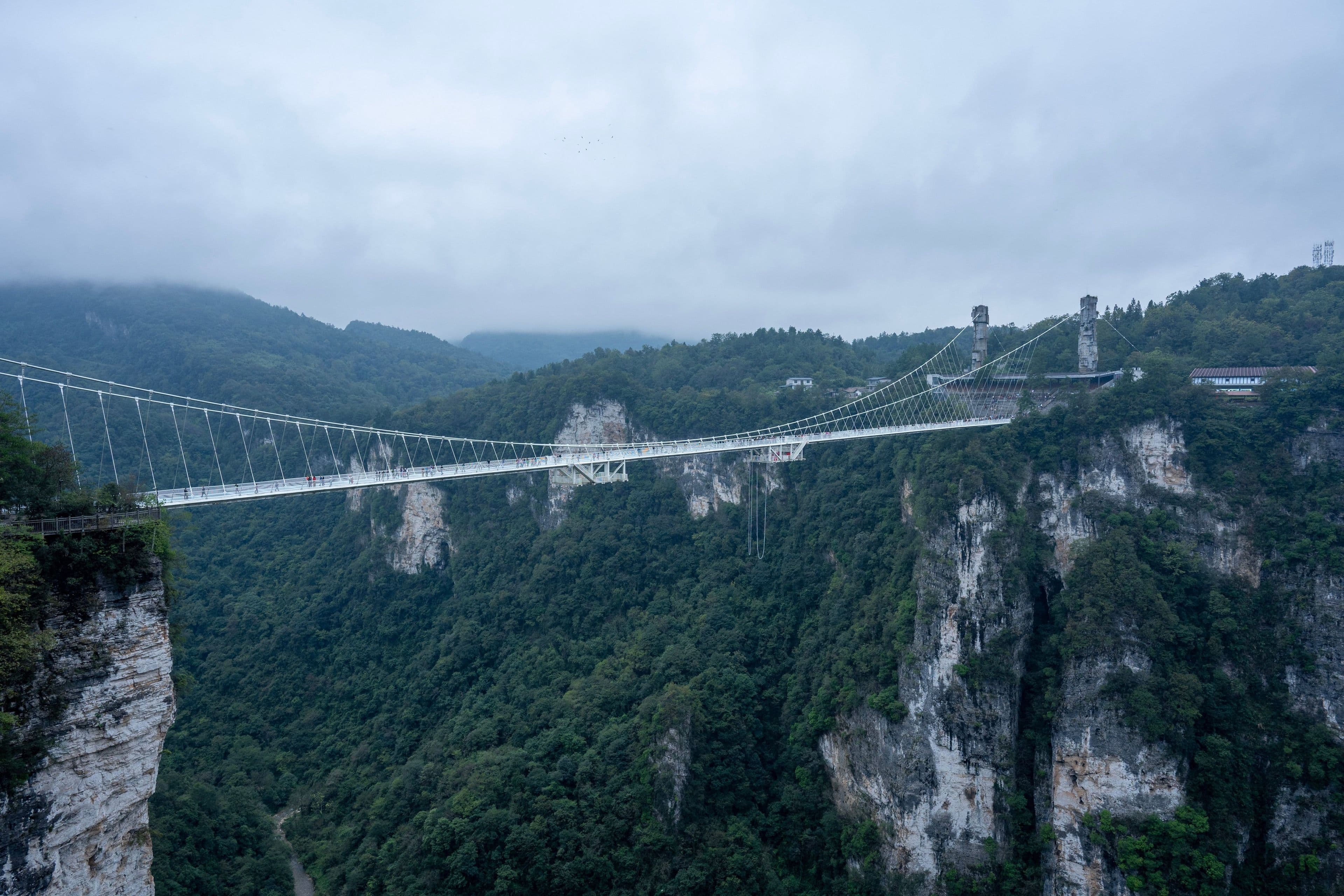 A glass viewing platform over a mountain canyon, China