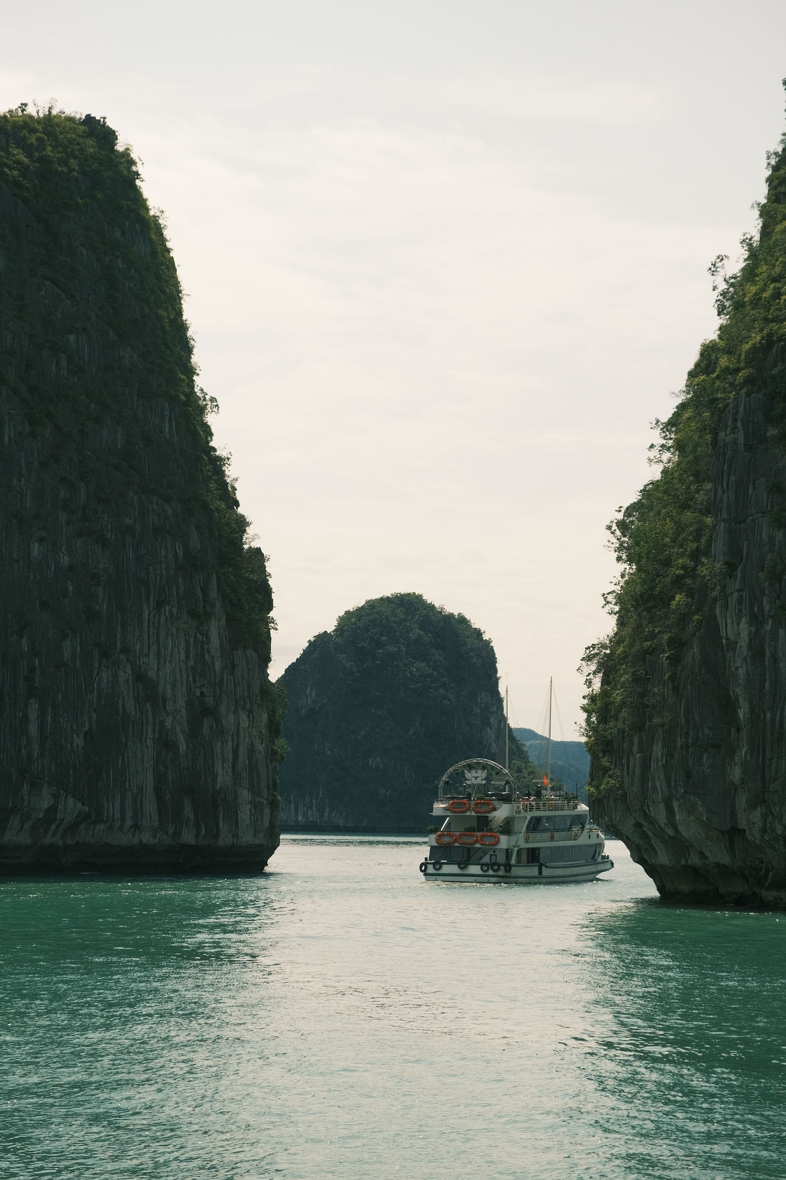 A cruise boat among the karsts of Halong Bay